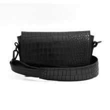 Load image into Gallery viewer, A black leather crossbody bag with a textured surface and an adjustable strap, displayed in an open position to show the interior compartment.