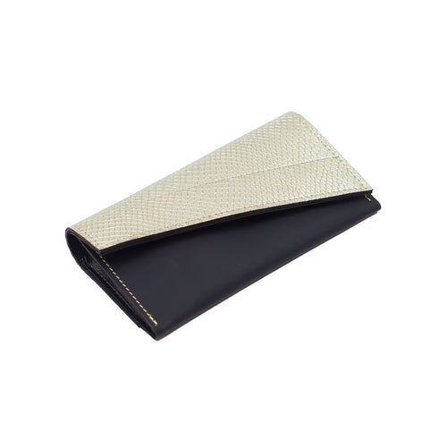 A black and gold leather purse with a magnetic snap closure.