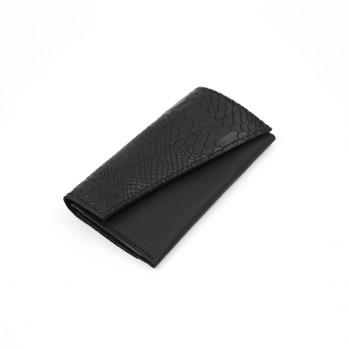 A black leather wallet with a textured pattern, closed with a magnetic snap.